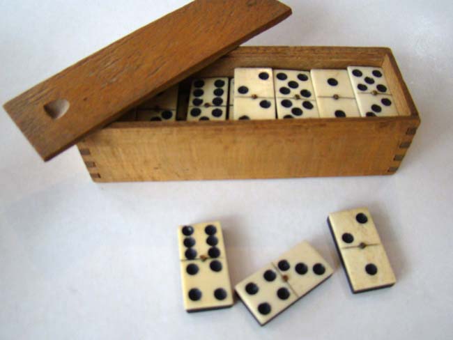 A Civil War era box of bone and ebony dominoes circa 1860-1870